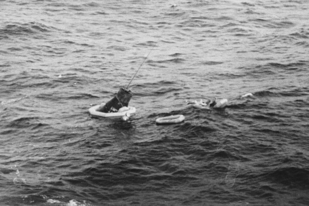 Scott Carpenter, prime pilot for the Mercury-Atlas 7 mission, being recovered from the Atlantic Ocean after his MA-7 flight